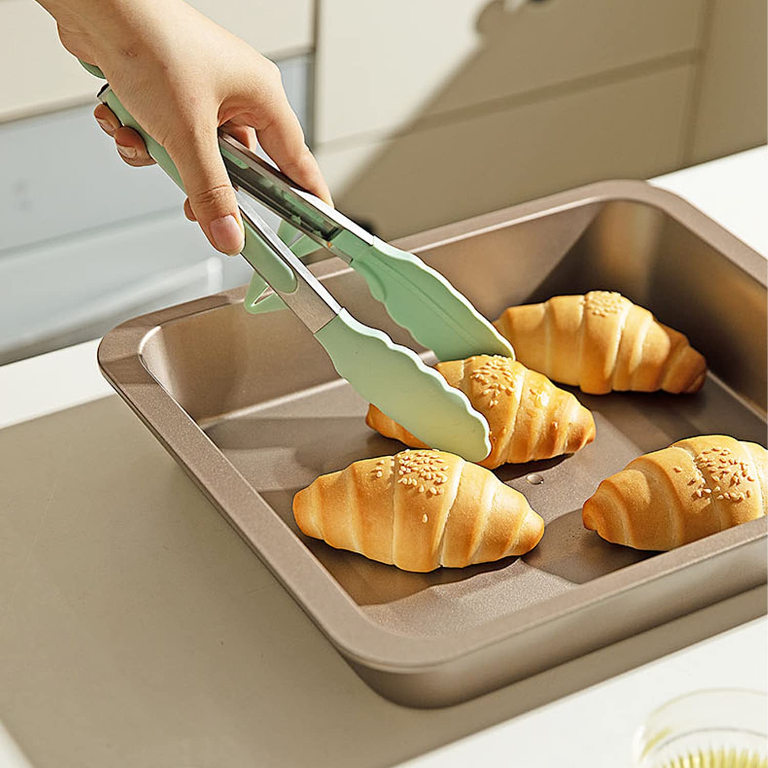 TOWINGO dishwasher-safe silicone tongs simplify cleanup after cooking.