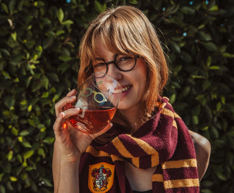 Toynk Harry Potter deathly hallows gold stemless glass adds magical flair to cocktails.