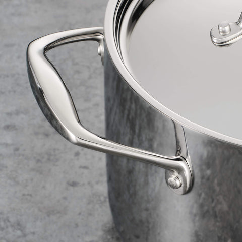 Tramontina Signature stock pot handles close-up shows secure riveted grip.