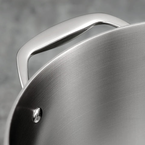 Lid closed on Tramontina braiser pan sealing moisture for flavorful results