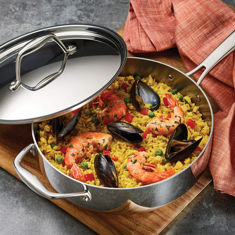 Tramontina tri-ply clad interior view shows aluminum core for precise cooking control.