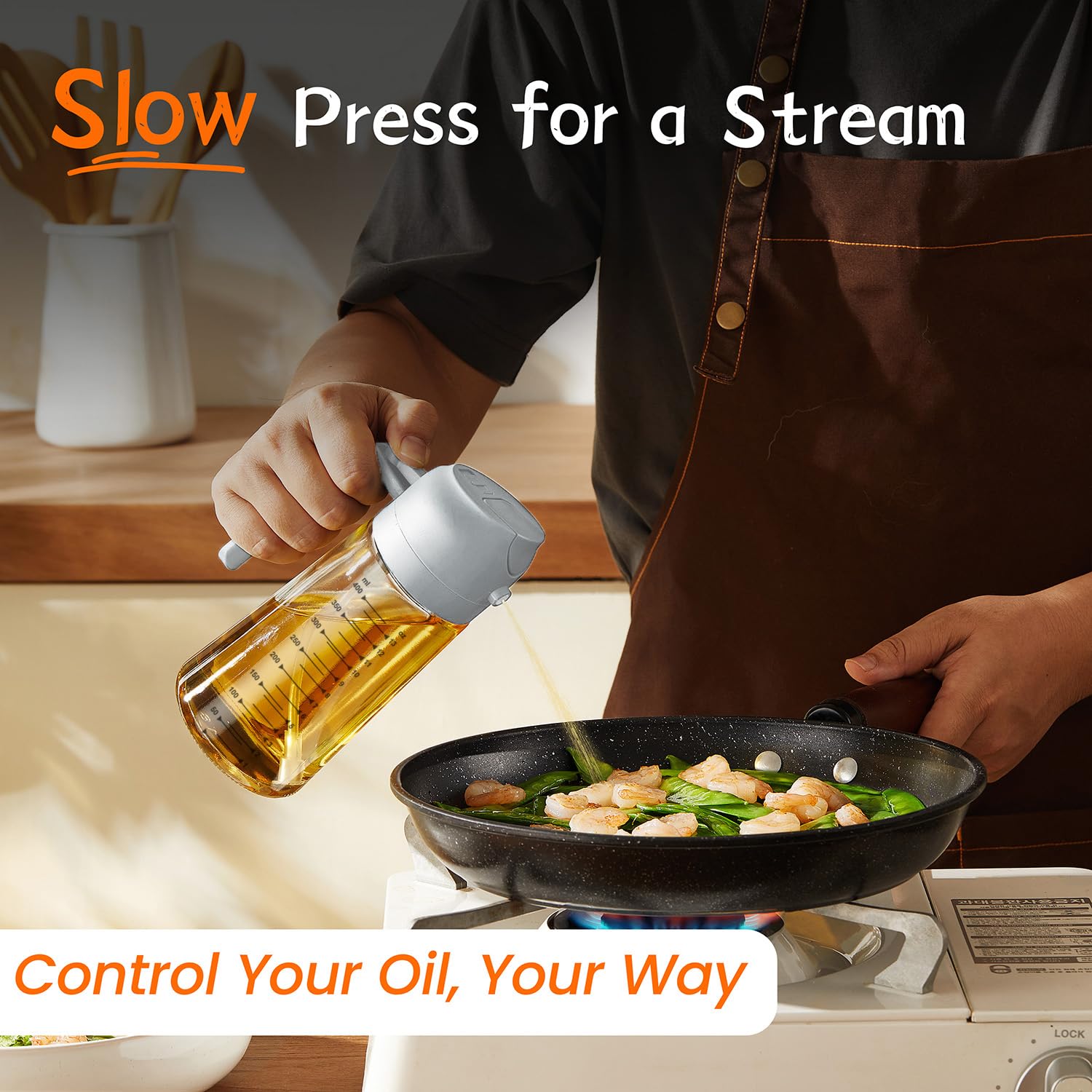 TrendPlain spray-and-pour olive oil dispenser in action on a cutting board.