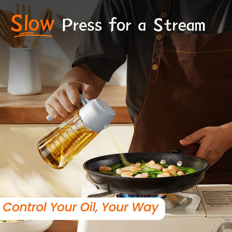 TrendPlain spray-and-pour olive oil dispenser in action on a cutting board.