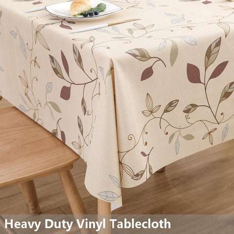 TruDelve beige vinyl tablecloth provides waterproof protection for rectangle dining tables.