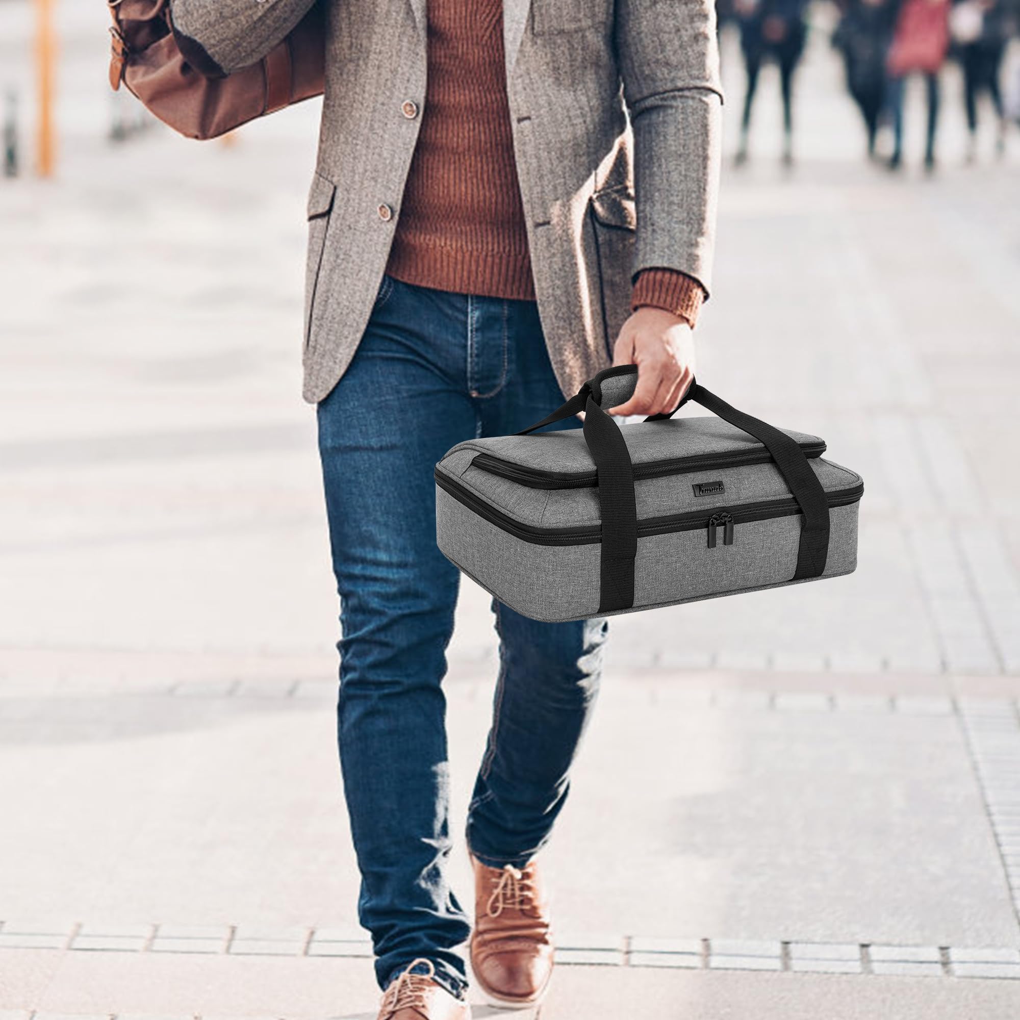 Trunab padded handle and dual zippers enable comfortable, quick access.