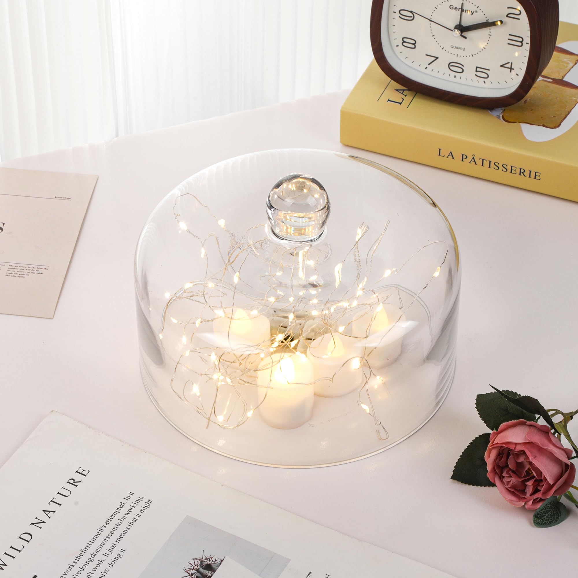 Twakutwaku transparent dome on a stand enables easy serving and viewing.