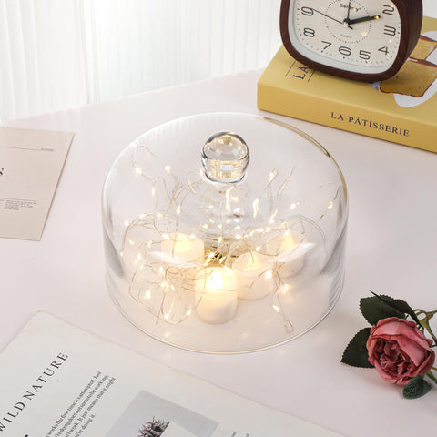 Twakutwaku transparent dome on a stand enables easy serving and viewing.