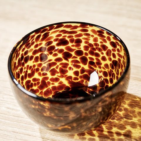 Two's Company tortoise print tidbit bowl close-up showing durable glass and design details for dips.