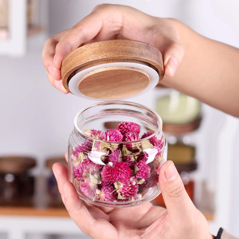 Tzerotone glass spice jars neatly stored in a drawer for quick access.