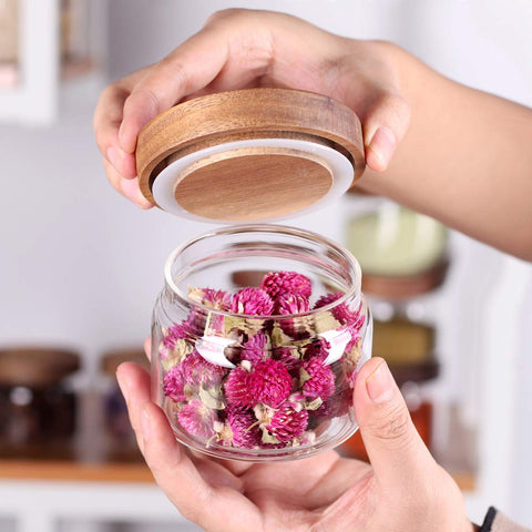 Tzerotone glass spice jars neatly stored in a drawer for quick access.