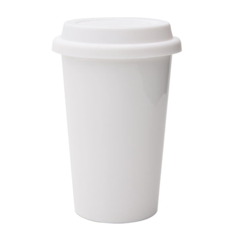 UDMG travel coffee cup with lid and sleeve in white ceramic for spill-free on-the-go sipping.