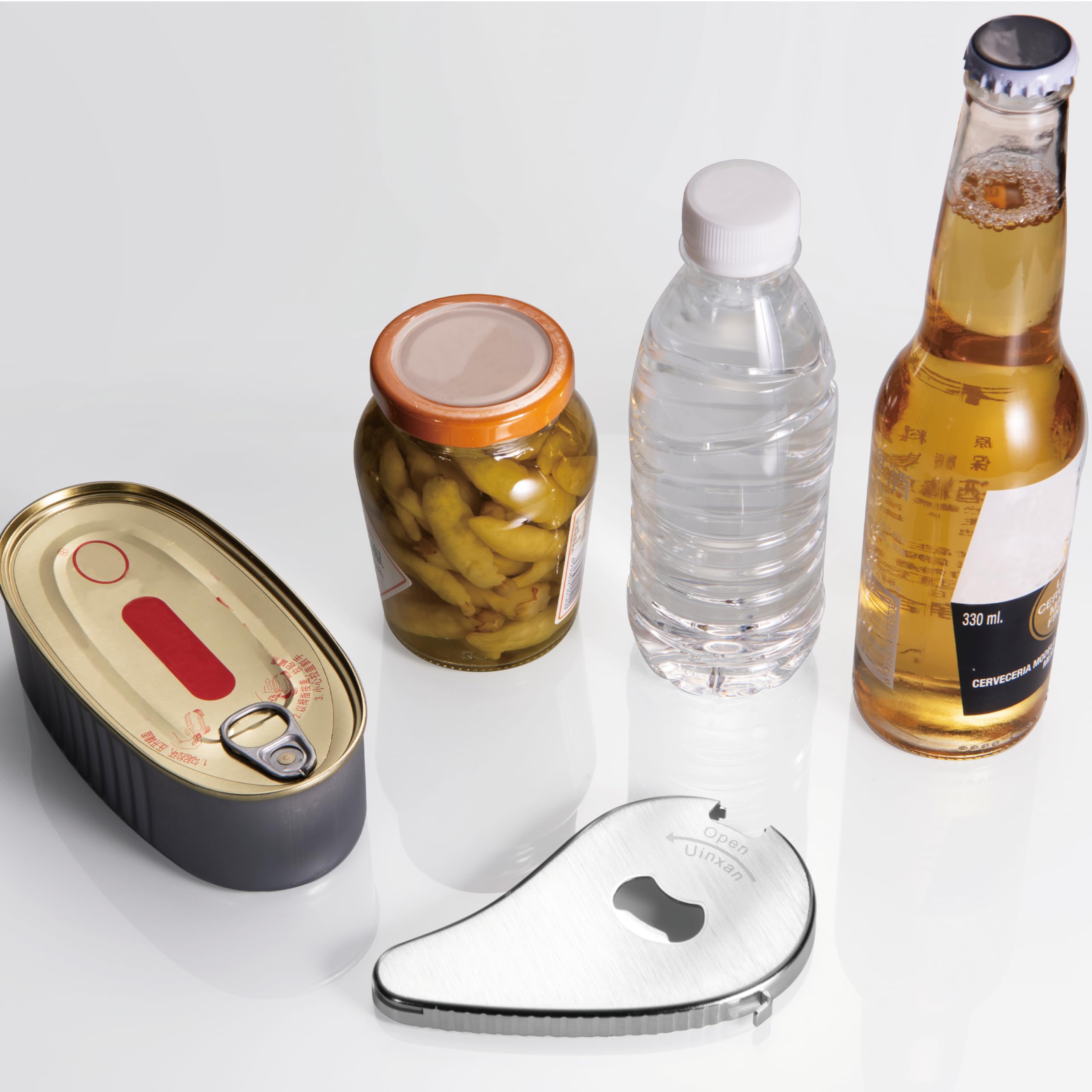 Uinxan portable opener fits 0.6–2.7 inch caps for versatile kitchen use.