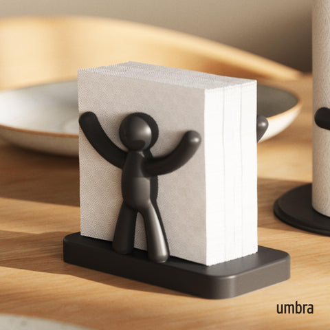 Umbra Buddy napkin holder in mint color holds napkins of all sizes.