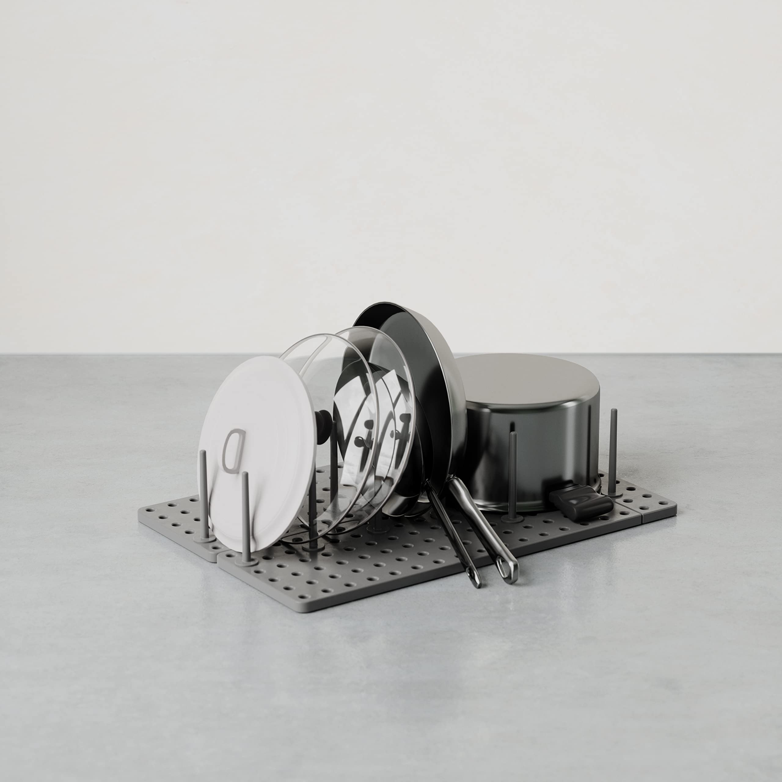 Umbra Peggy pegboard-style setup demonstrates flexible layout for containers and utensils.