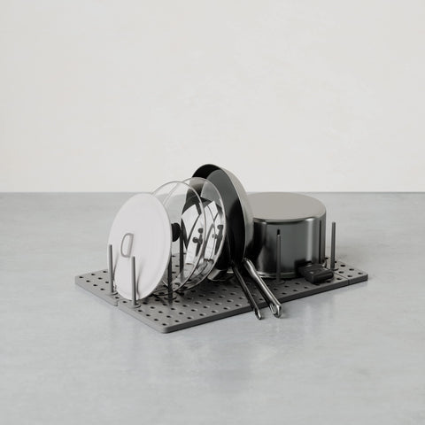 Umbra Peggy pegboard-style setup demonstrates flexible layout for containers and utensils.