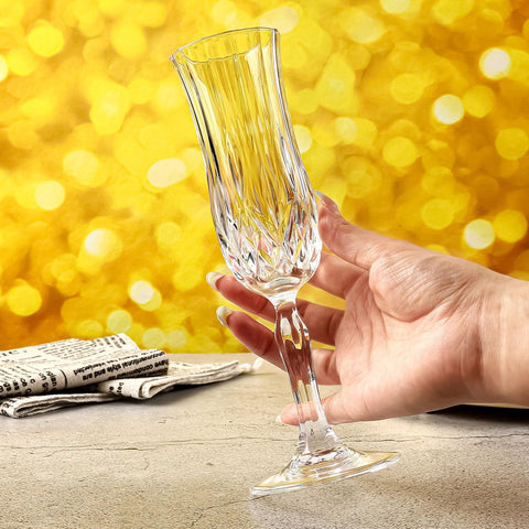 Guest toasts with UMEIED champagne flutes in a celebratory moment