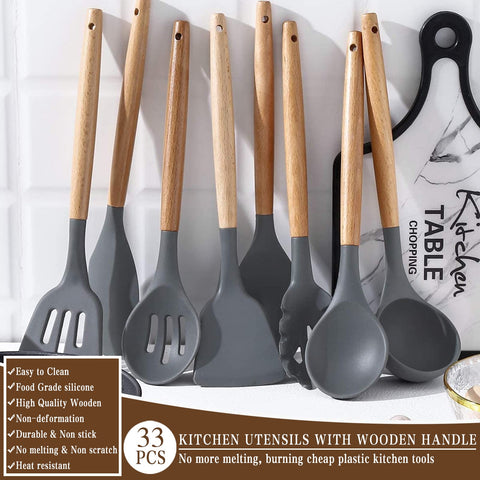 Umite Chef kitchen tongs gripping hot food safely with heat-resistant silicone tips.