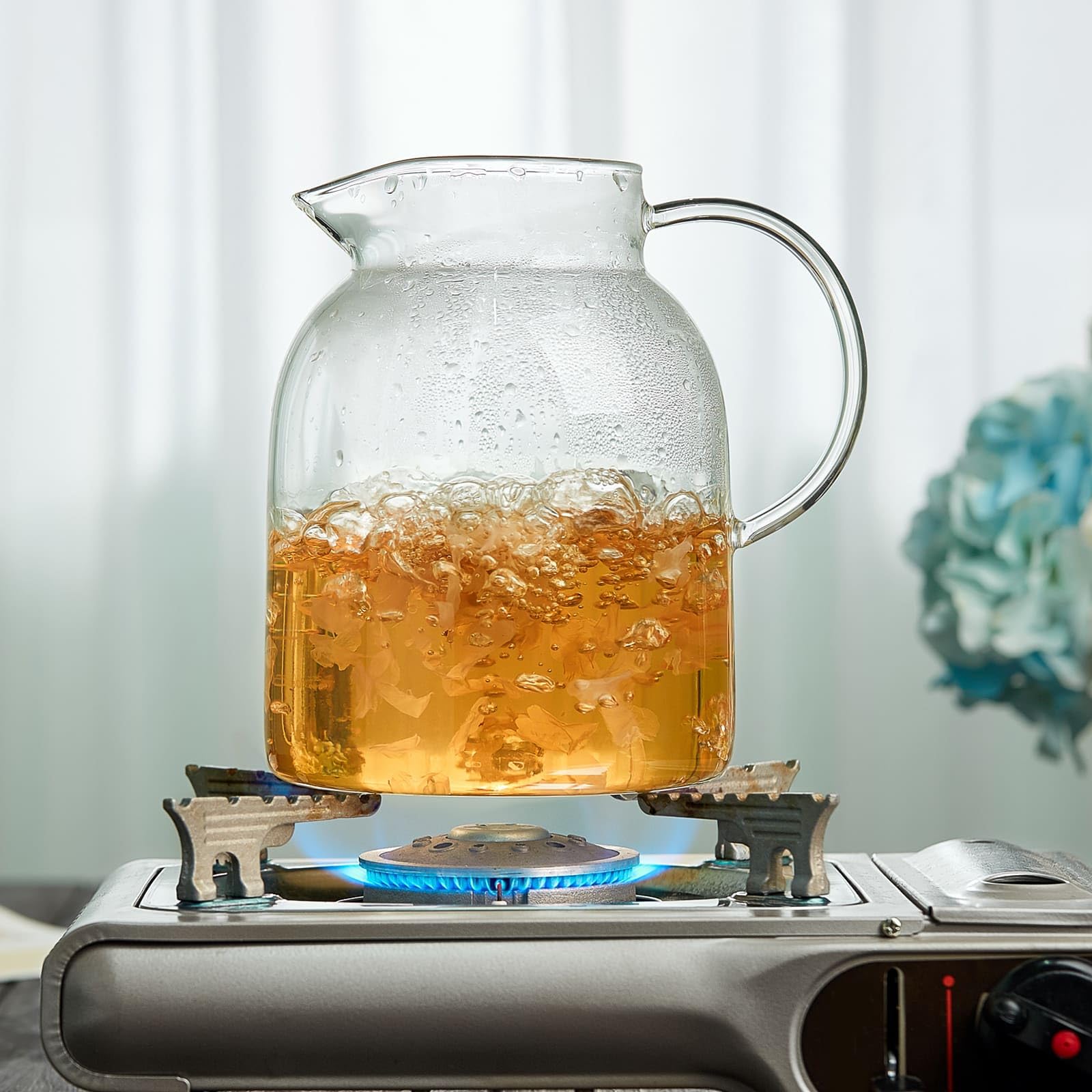 Unbreakable 2-in-1 infusion pitcher for hot and cold beverages and blooming tea.