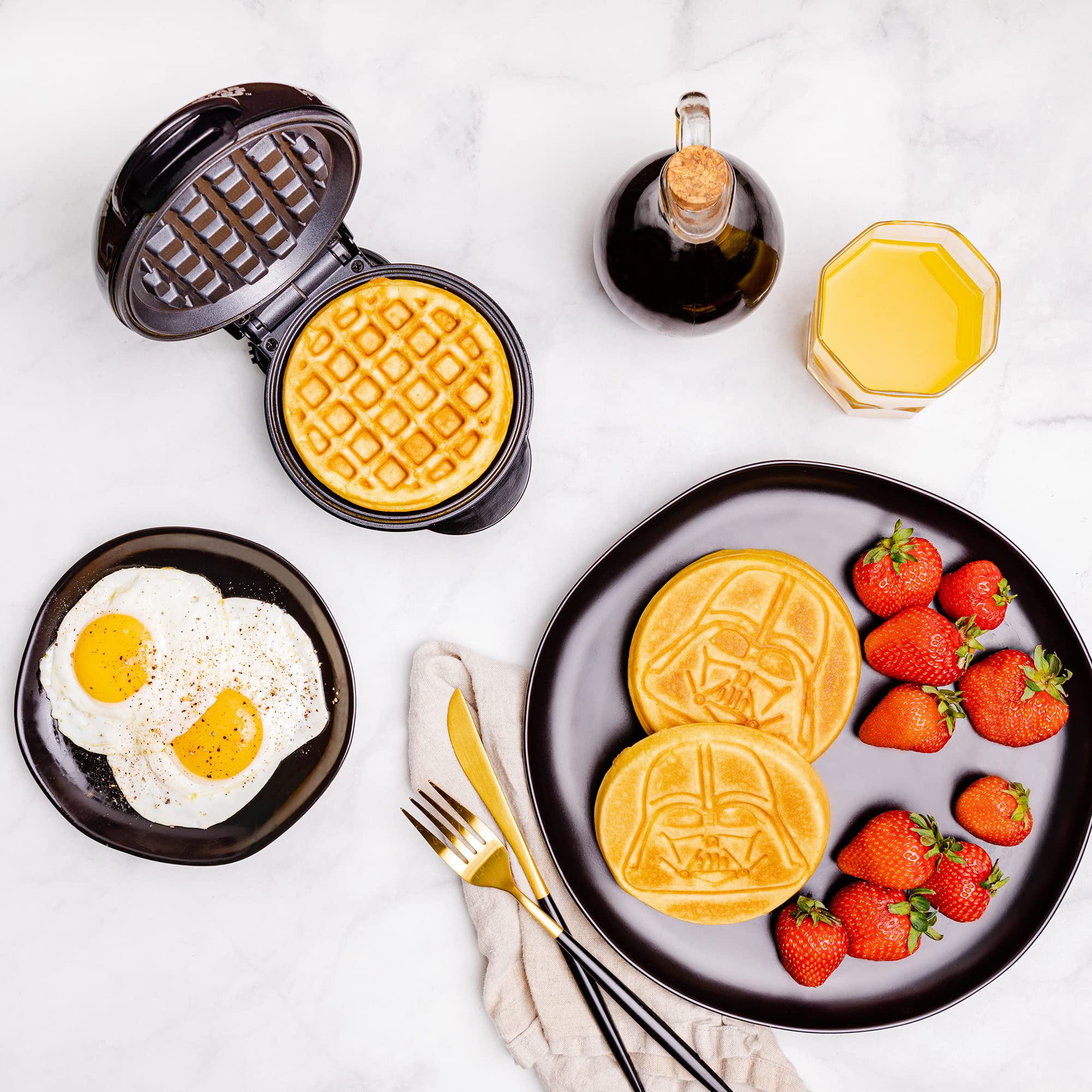 Uncanny Brands Darth Vader mini waffle maker batter pour area for quick prep.