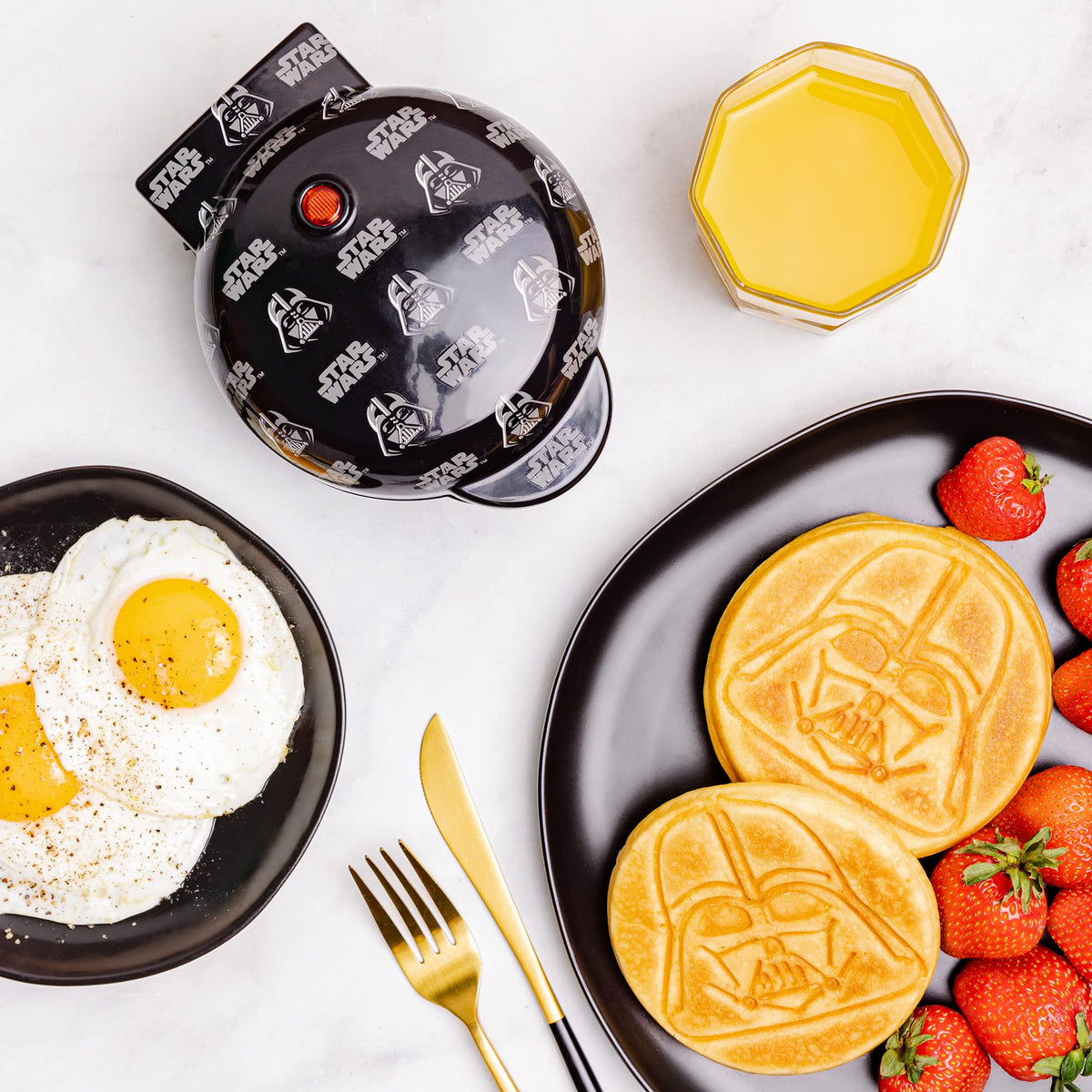 Uncanny Brands Darth Vader mini waffle maker lid artwork adds playful kitchen decor.