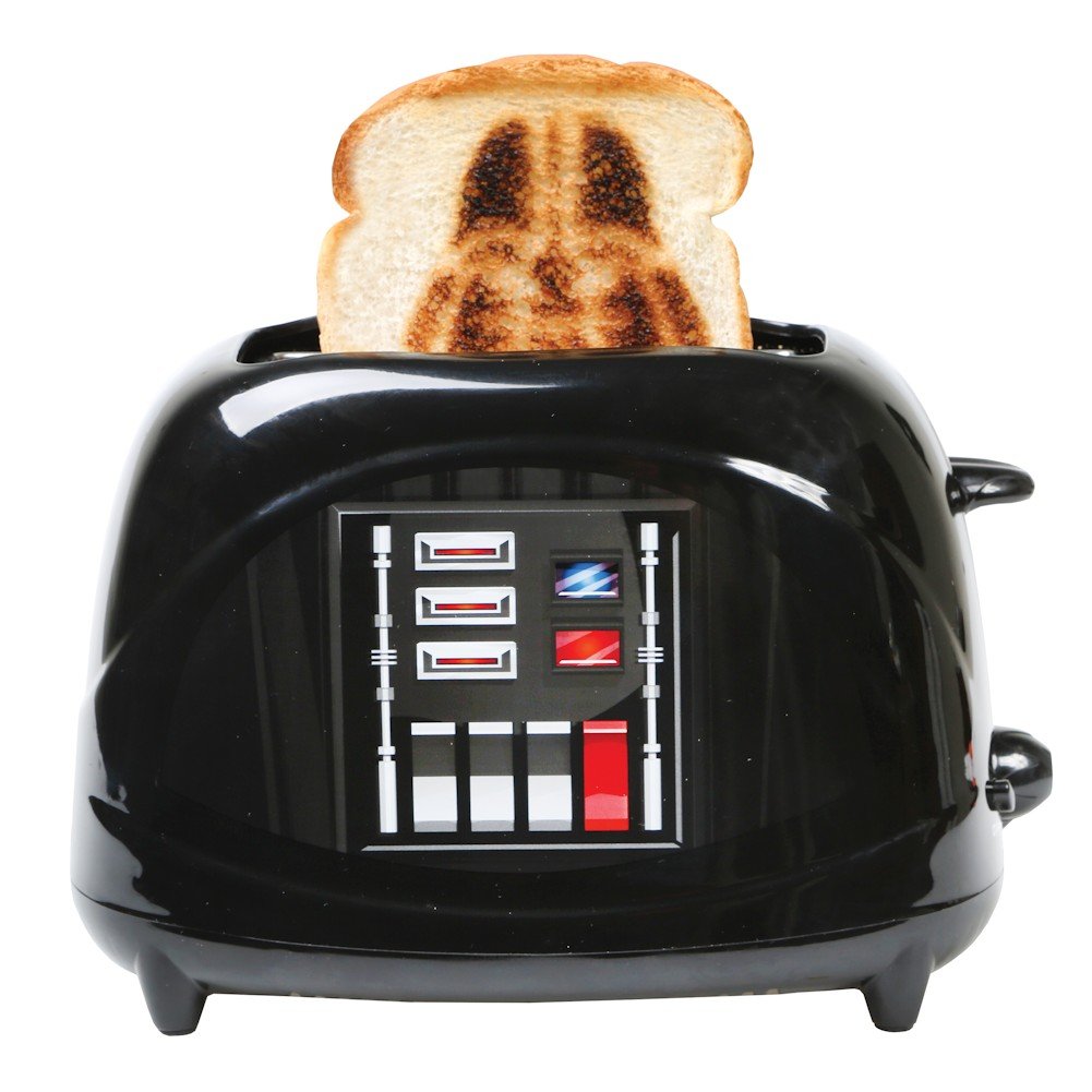 Uncanny Brands Darth Vader toaster helmet pops for playful mornings.