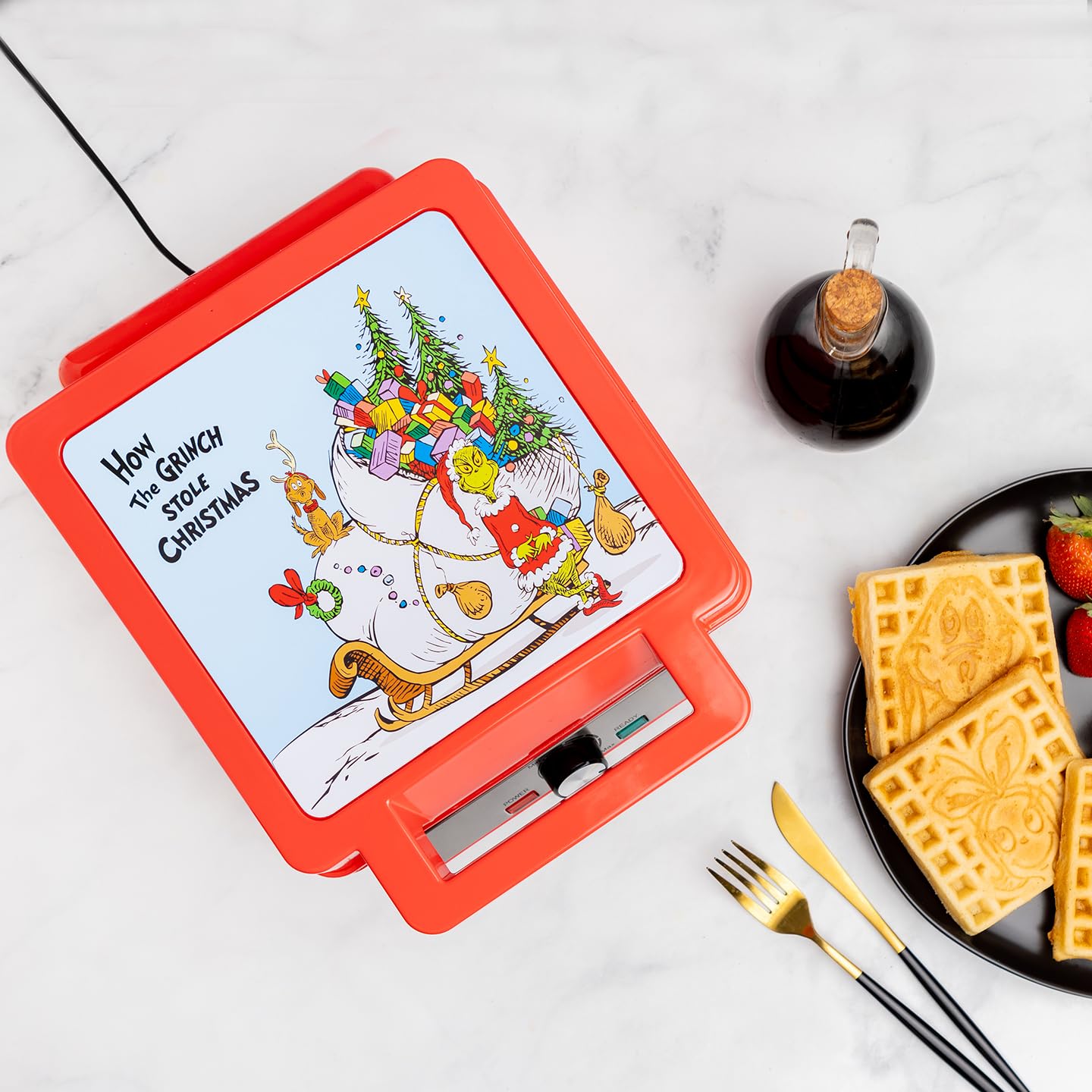Uncanny Brands Grinch Deluxe Waffler on counter for cozy mornings.