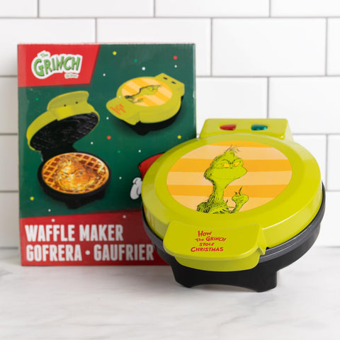 Uncanny Brands Grinch waffle maker measures 7x6x10 inches for compact storage.