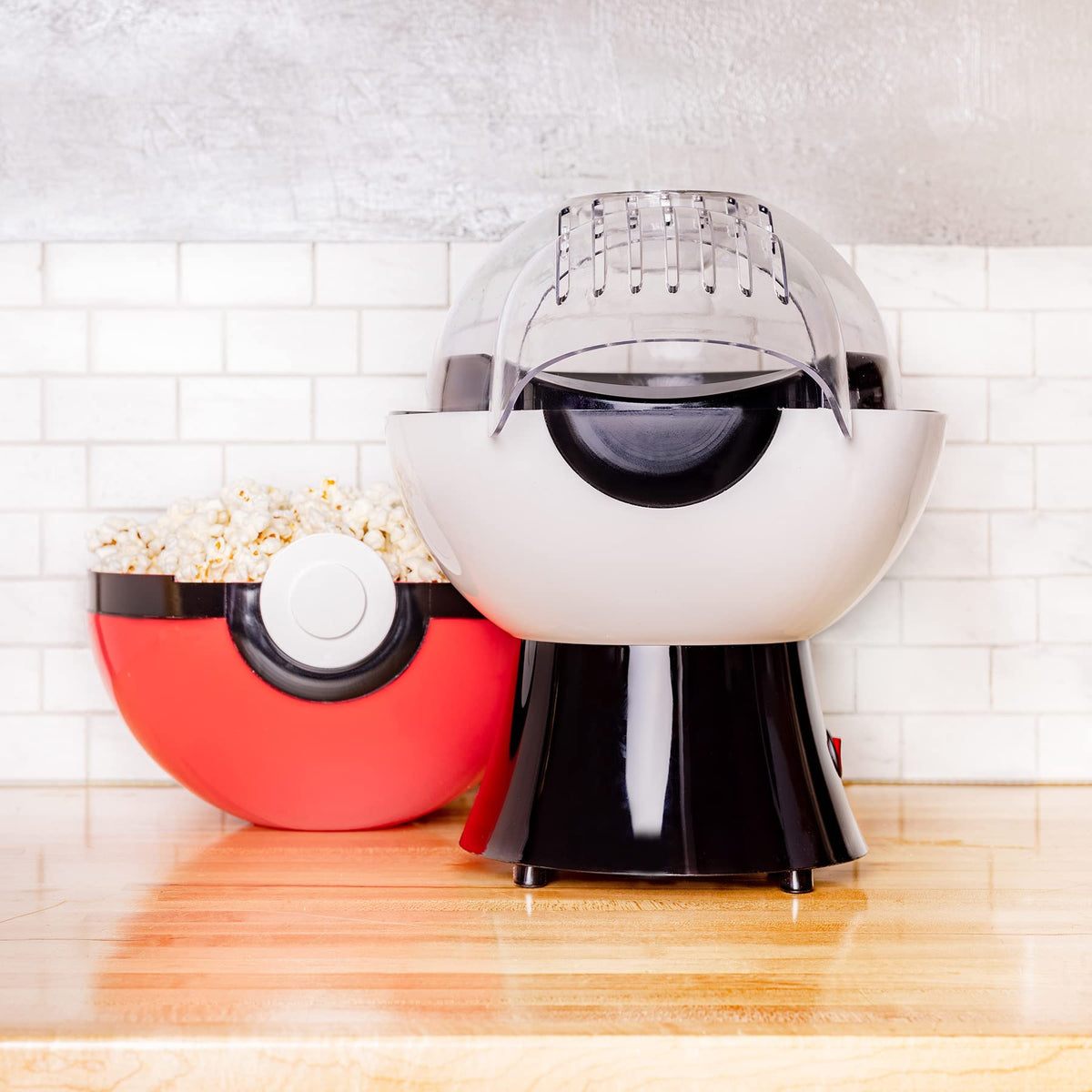 Uncanny Brands Poké Ball Popcorn Maker front view, eye-catching design for gatherings