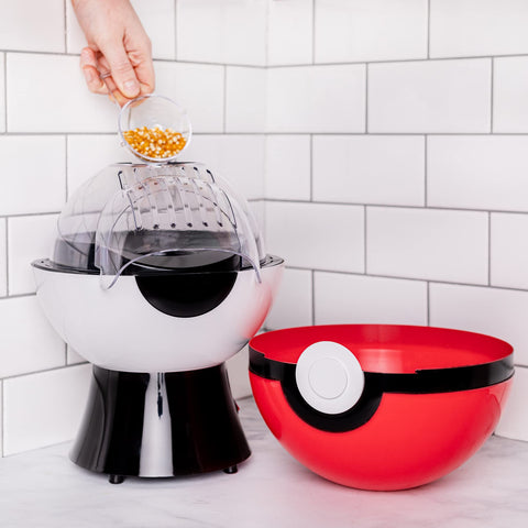 Uncanny Brands Poké Ball Popcorn Maker lid doubles as serving bowl in use