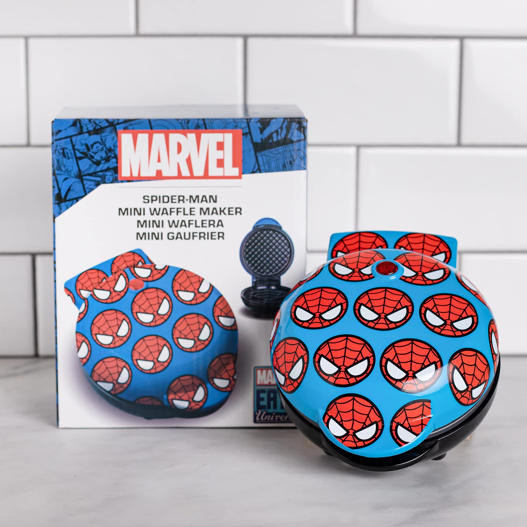 Uncanny Brands Spider-Man mini waffle maker compact design fits small kitchens and dorms.