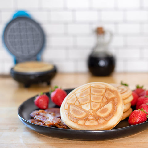 Uncanny Brands Spider-Man mini waffle maker non-stick plates simplify cleanup and breakfast prep.