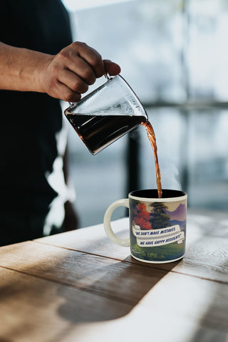 The Unemployed Philosophers Guild Bob Ross 12 oz ceramic mug with a comfortable handle.