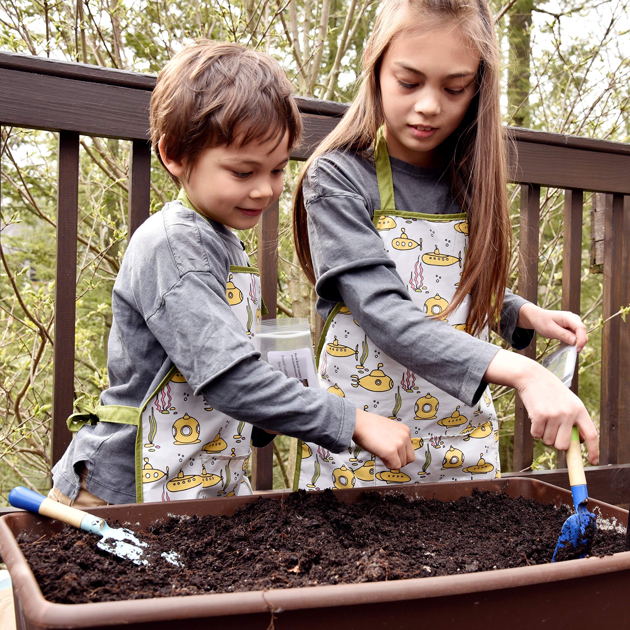 Urban Infant Little Helper apron with adjustable neck fits growing helpers comfortably.