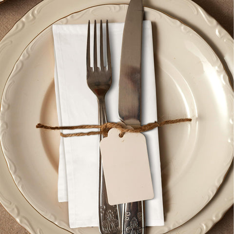 Hotel-style Urban Villa napkins in ivory ready for service setup.