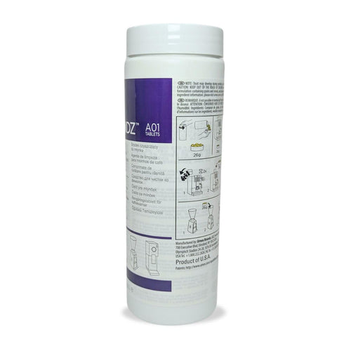 Urnex SuperGrindz tablets closeup highlighting natural gluten-free grinder cleaner.
