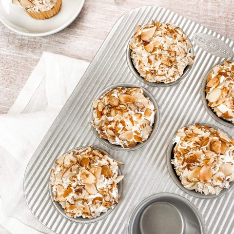 USA Pan muffin pan with reinforced steel rims for warp resistance and secure handling.
