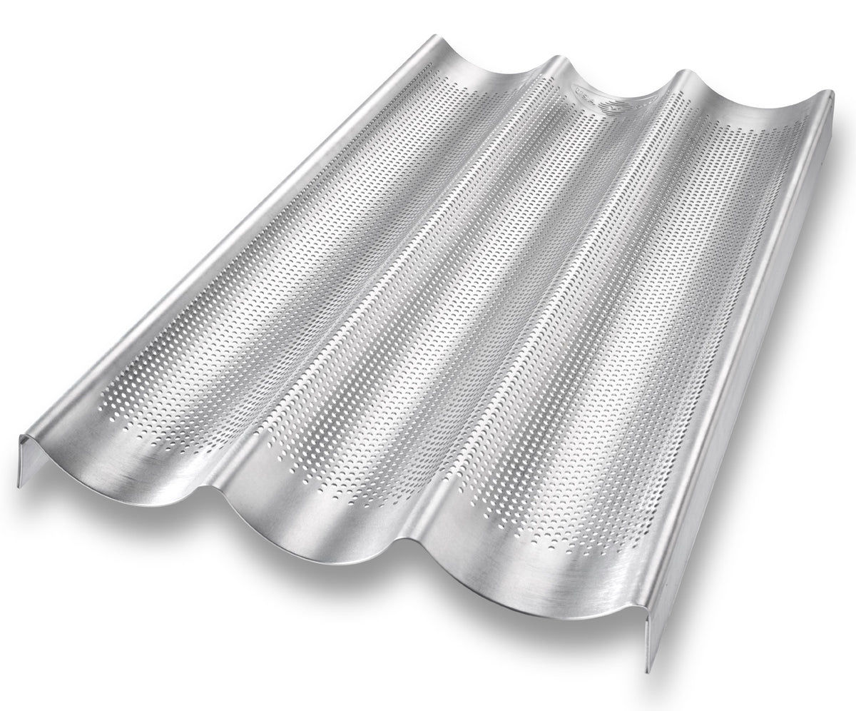 USA Pan baguette pan perforated bottom highlights even heat and easy release for crisp baguette crust.