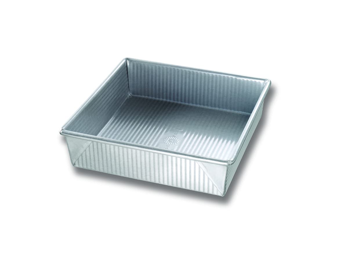 USA Pan 9-inch square pan with corrugated surface for even browning and easy release.