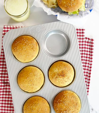 USA Pan mini round cake pan side view emphasizing sturdy construction for even baking