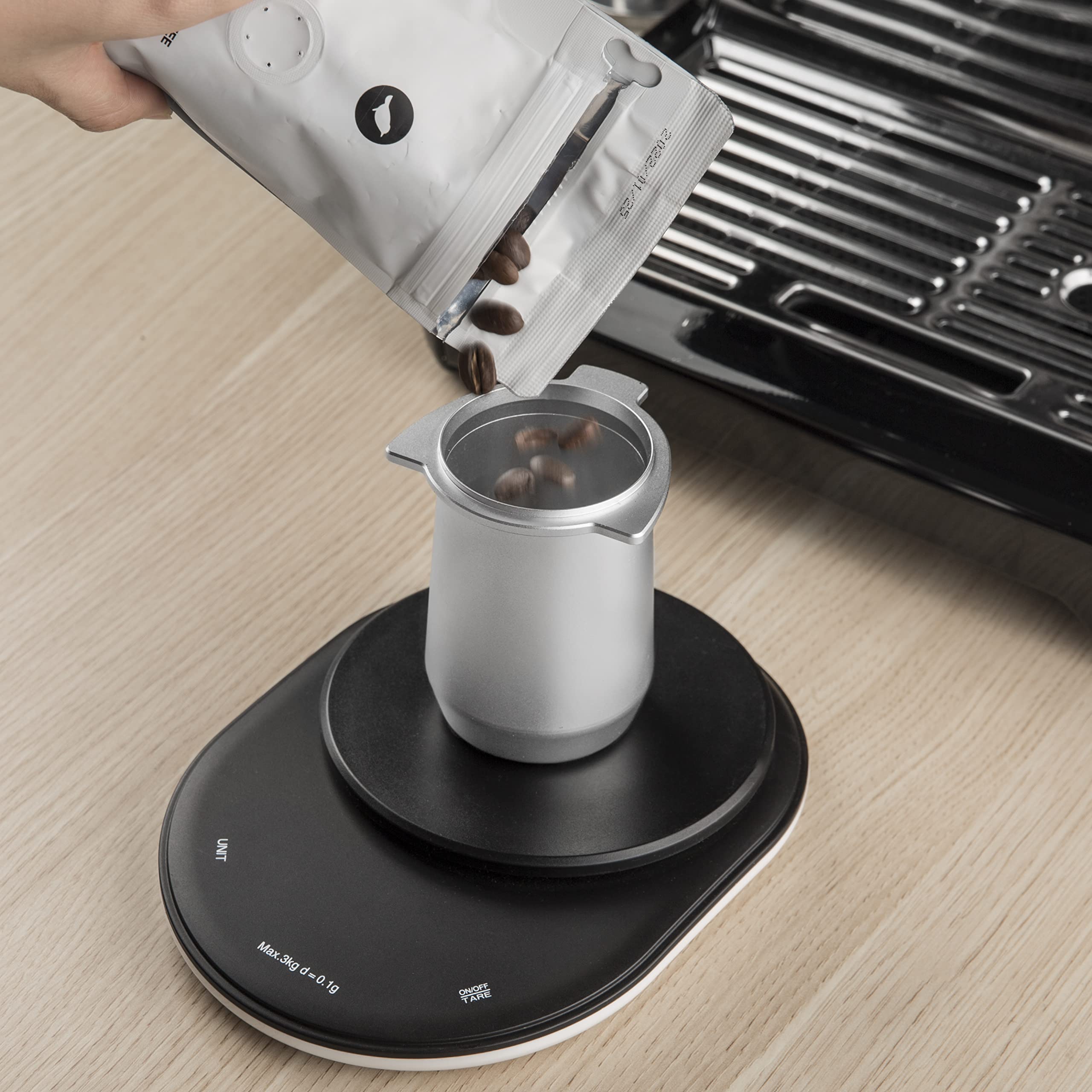 Useamie dosing cup fits 54mm Breville portafilters for versatile use.