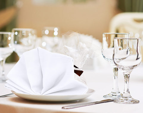 Utopia Kitchen napkins care guide image illustrating machine washable upkeep.
