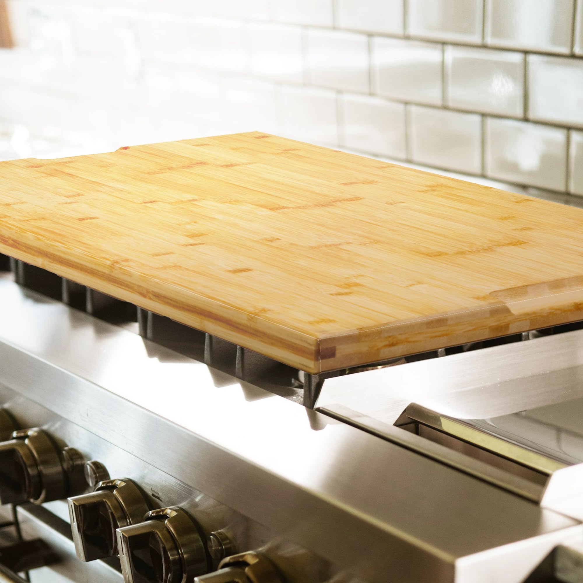 Utoplike over-sink stove-top cover keeps countertops tidy during cooking.