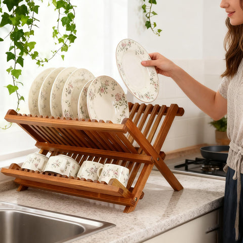 Utoplike teak dish drainer rack folded for compact storage after use.