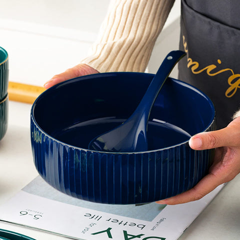 UUEMB navy ceramic serving bowl enhances table decor for entertaining.