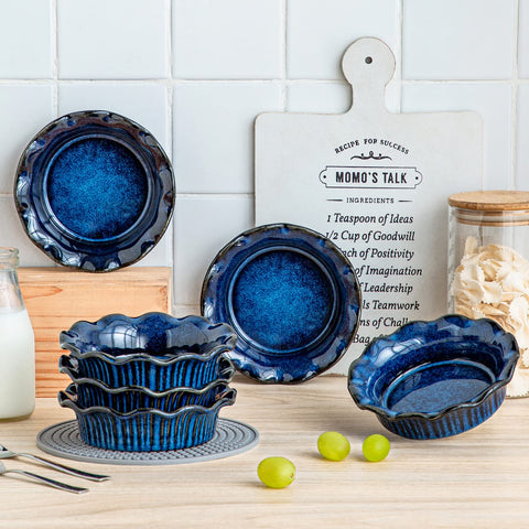 Stacked blue pans save cabinet space and stay organized.