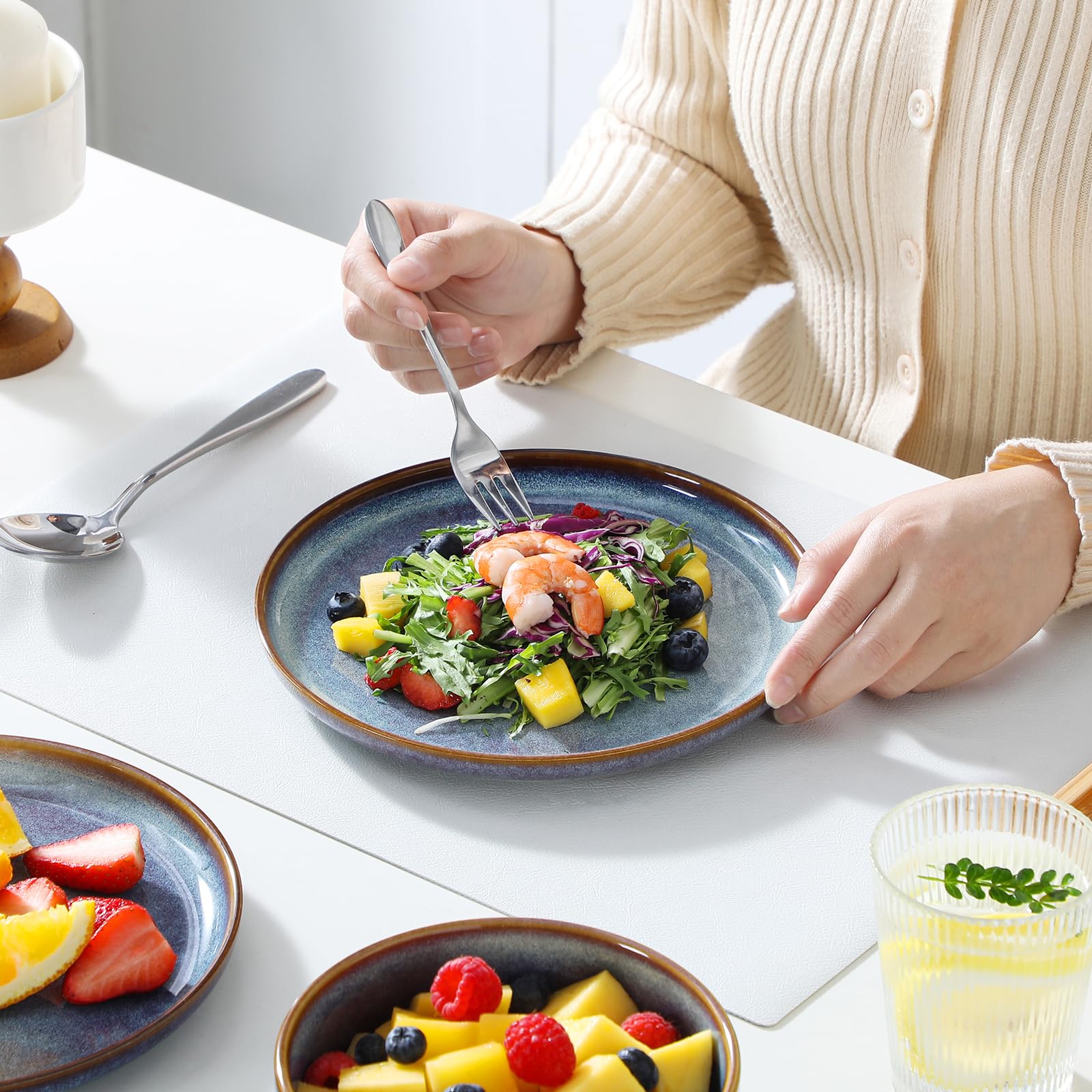 Vancasso Playa kitchen-dining scene demonstrates durable ceramic suited for daily use and entertaining.