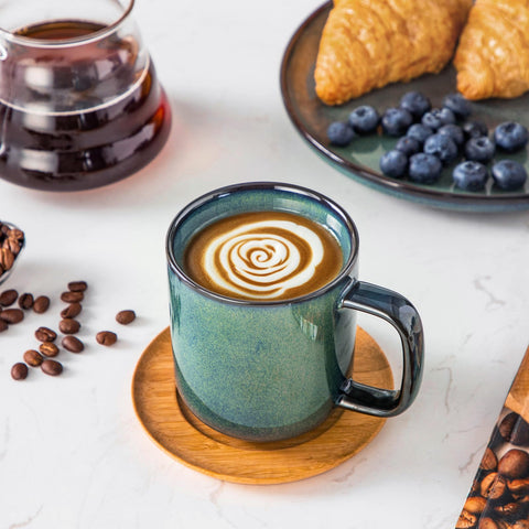 Vancasso STARRY green mug thick walls help keep drinks warm longer.