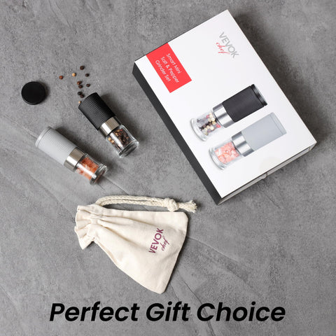 VEVOK CHEF compact pepper mills in hand, demonstrating travel-friendly size.