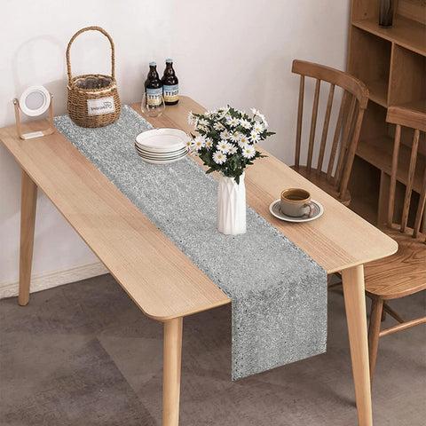 VHH holiday dinner table with silver sequin runner for festive ambiance.