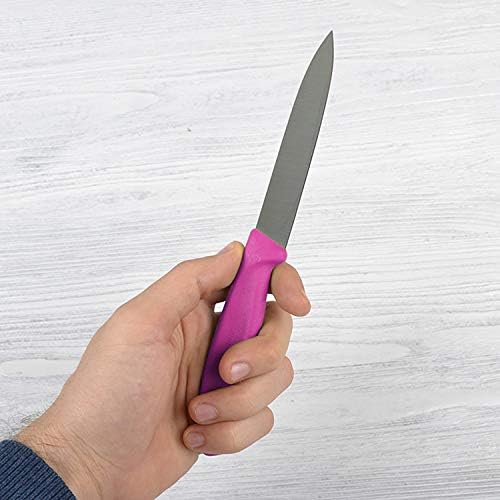 Victorinox paring knife in use peeling an apple for clean, even slices.